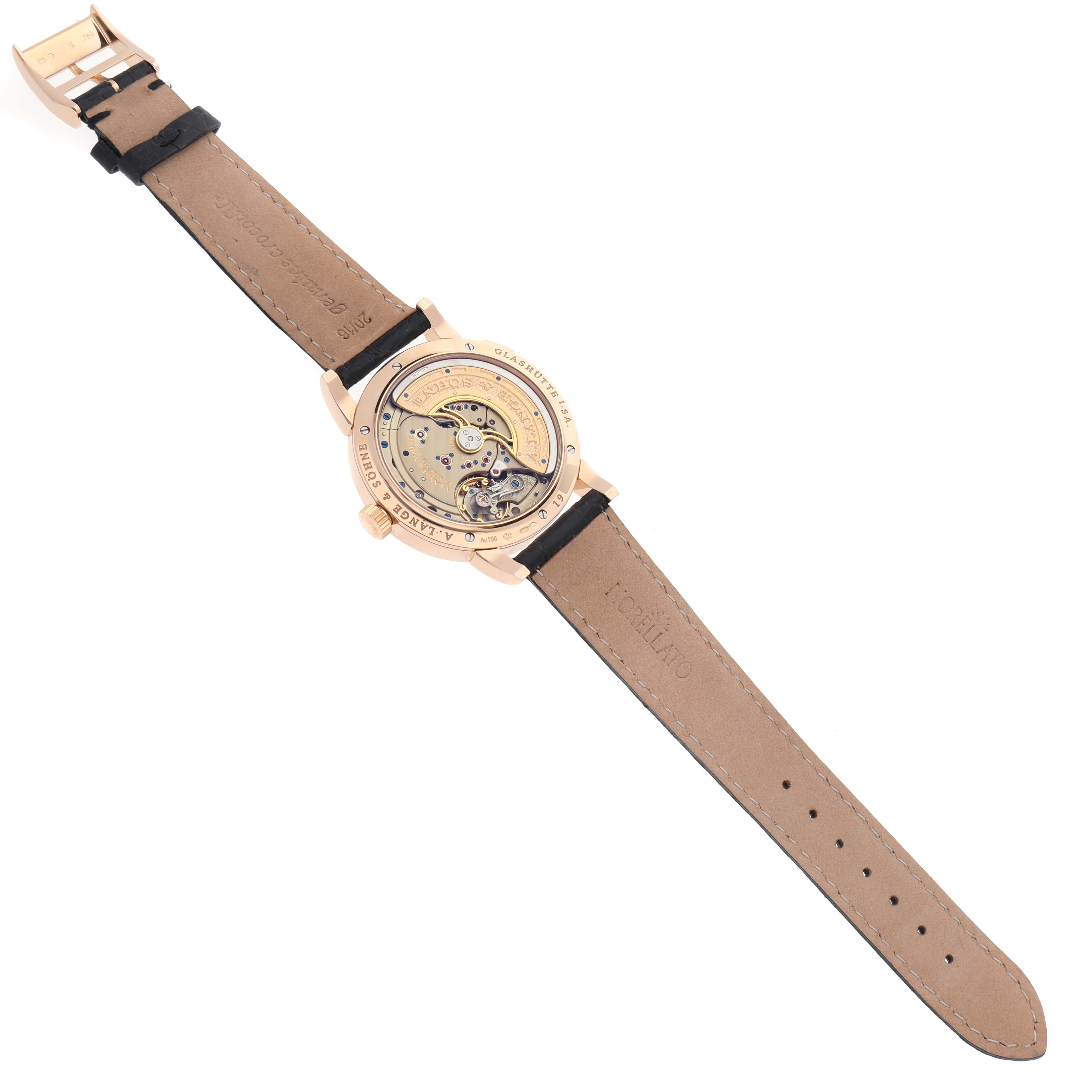 The image shows the back view of the A. Lange & Sohne Lange 1 320.032 Men's Rose Gold Silver Dial watch, highlighting its mechanical movement.