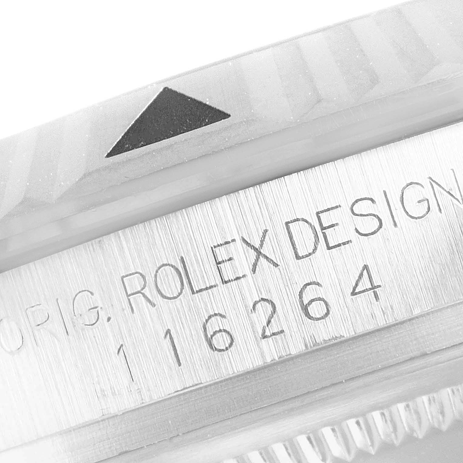 This close-up image of the Rolex Turn-o-Graph 116264 Men's Stainless Steel White Dial 116264 Men's Stainless Steel White Dial watch shows the bezel with an engraved triangle and part of the case with the model number 116264.