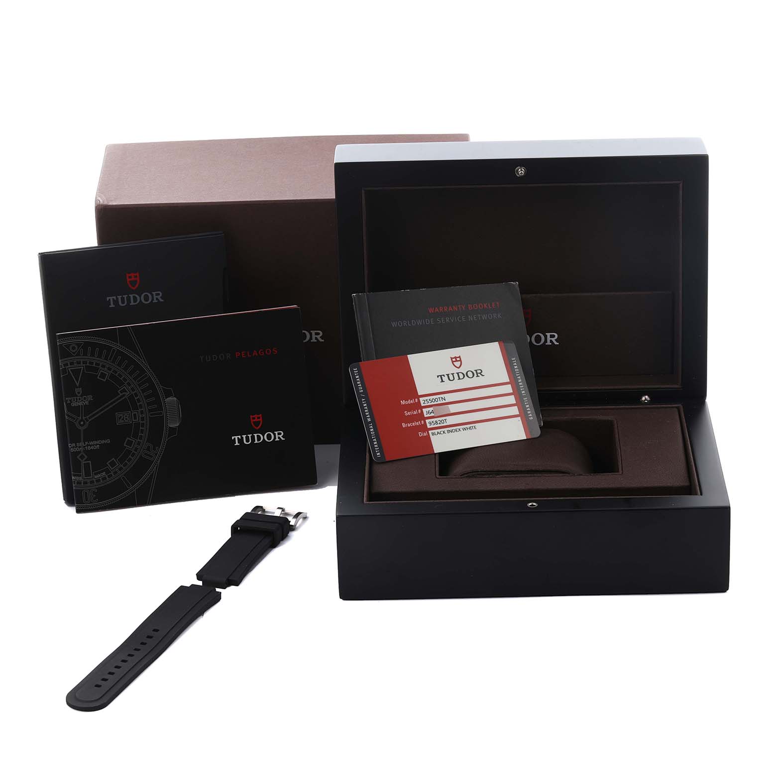 The image shows a Tudor Pelagos 25500TN Men's Titanium Black Dial 25500TN Men's Titanium Black Dial watch box, manuals, warranty card, and an extra strap from a front angle.