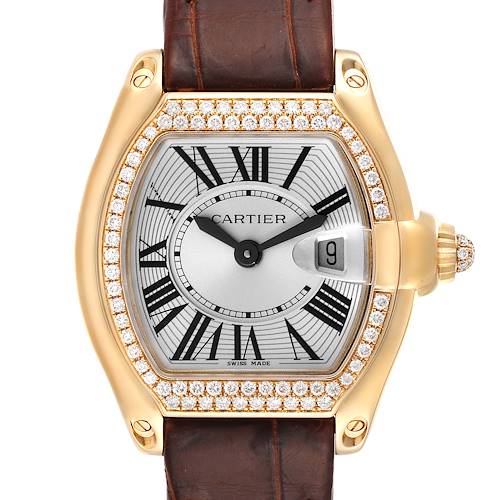 The Cartier Roadster WE500160 Women's Yellow Gold Silver Dial WE500160 Women's Yellow Gold Silver Dial watch is displayed front-on, showing its round Roman numeral dial, leather strap, and diamond-encrusted bezel.