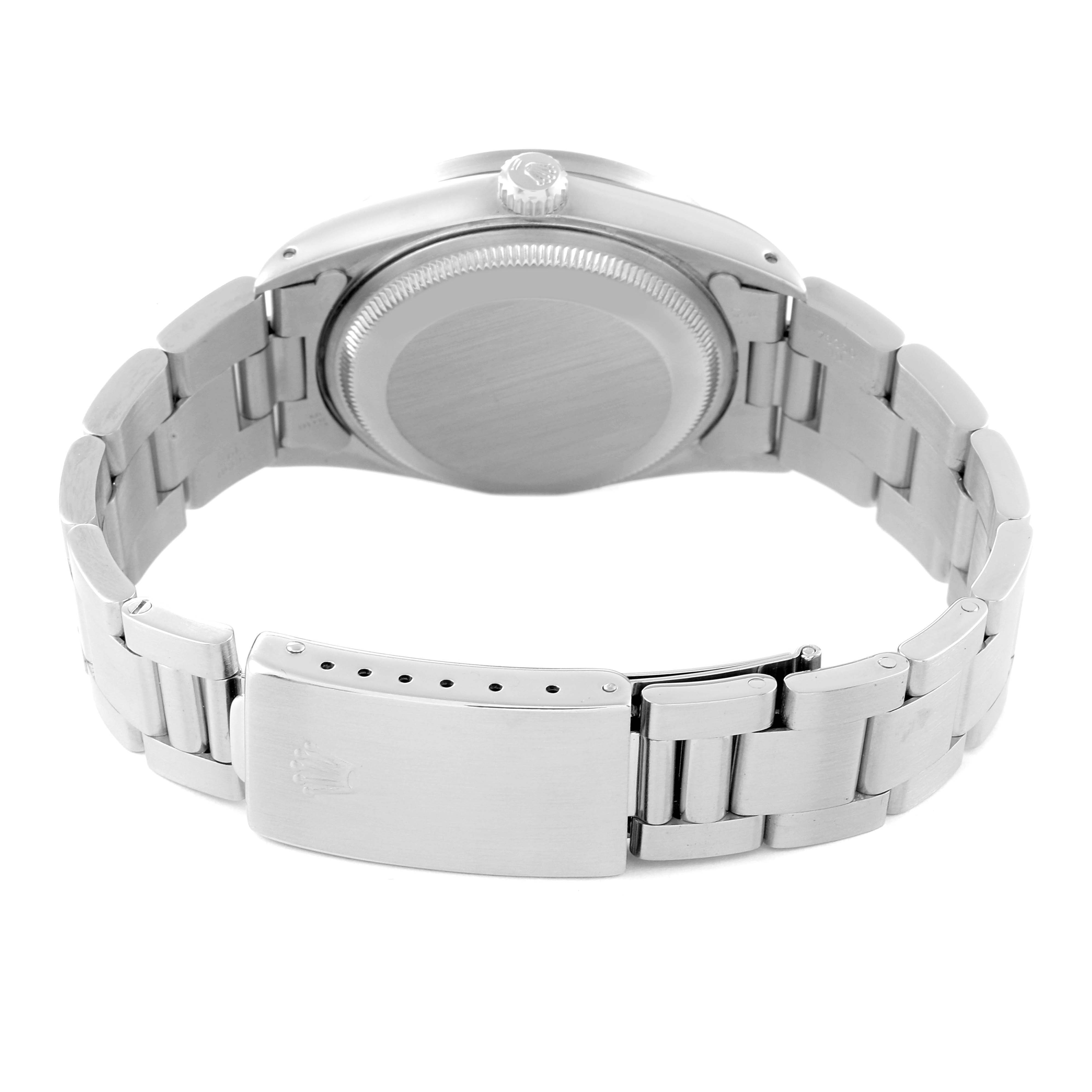 The image shows the back view of a Rolex Date 15210 Men's Stainless Steel Silver Dial 15210 Men's Stainless Steel Silver Dial model watch, focusing on the case back, bracelet, and clasp.