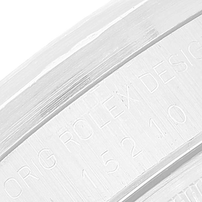 This image shows a close-up of the engraved inner bezel or rehaut on a Rolex Date 15210 Men's Stainless Steel Silver Dial 15210 Men's Stainless Steel Silver Dial model.
