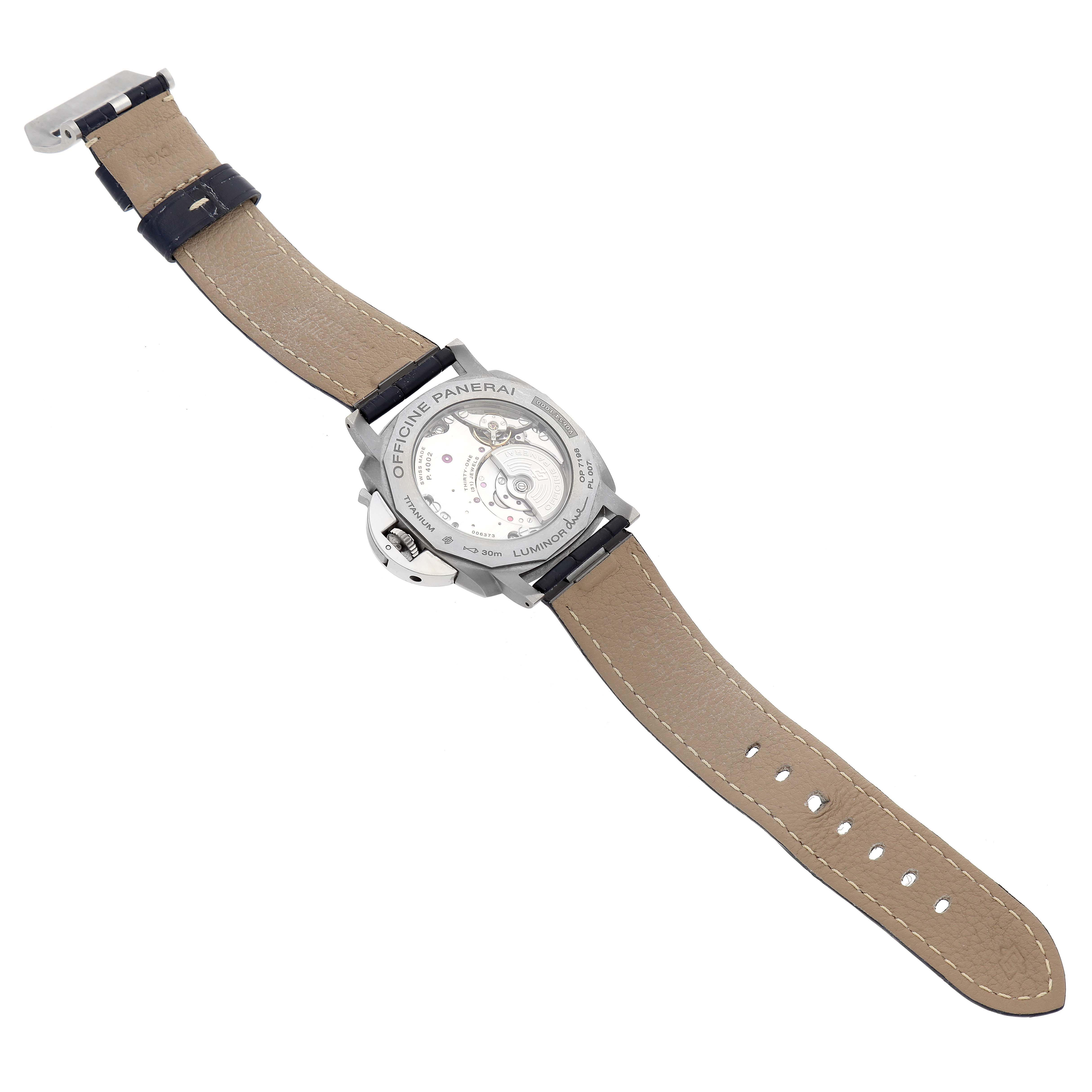 The image shows the underside and movement of a Panerai Luminor Due PAM00964 Men's Titanium Blue Dial PAM00964 Men's Titanium Blue Dial watch, focusing on the open case back and leather strap.