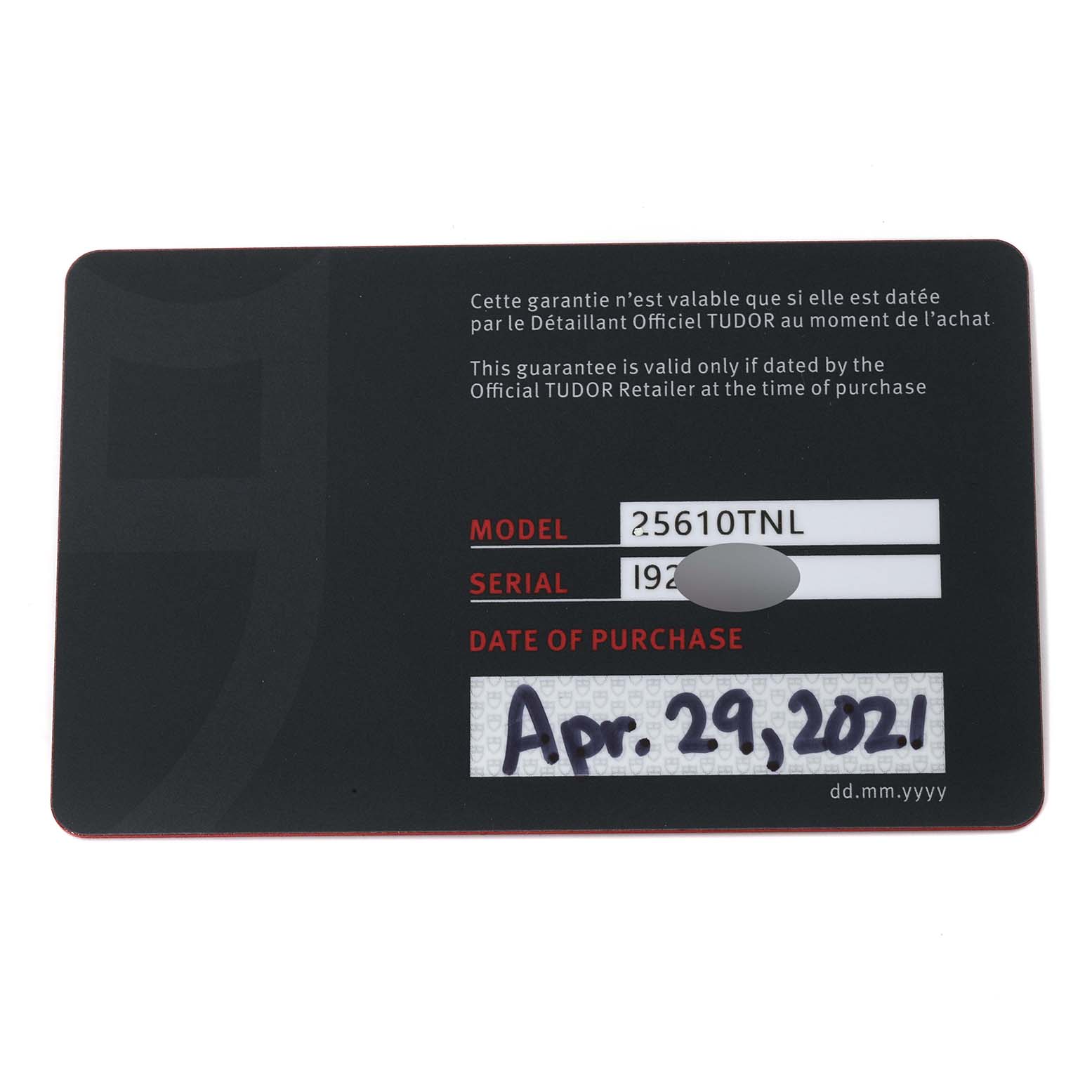 This is the warranty card for the Tudor Pelagos 25610TNL Men's Titanium Black Dial 25610TNL Men's Titanium Black Dial model, showing the model number, serial number (partially obscured), and date of purchase.