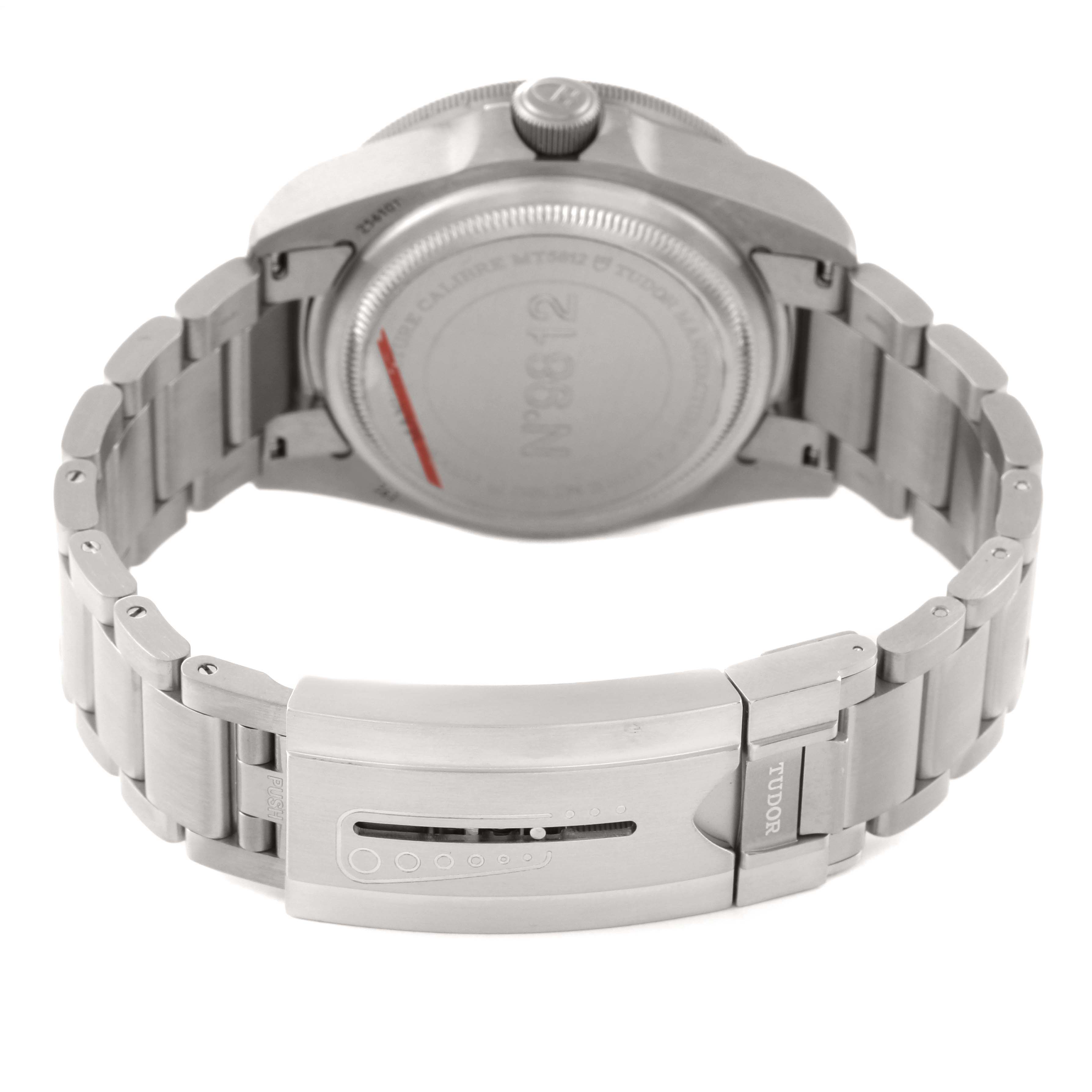 The image shows the back case and bracelet clasp of a Tudor Pelagos 25610TNL Men's Titanium Black Dial 25610TNL Men's Titanium Black Dial watch, highlighting the metal links and clasp mechanism.