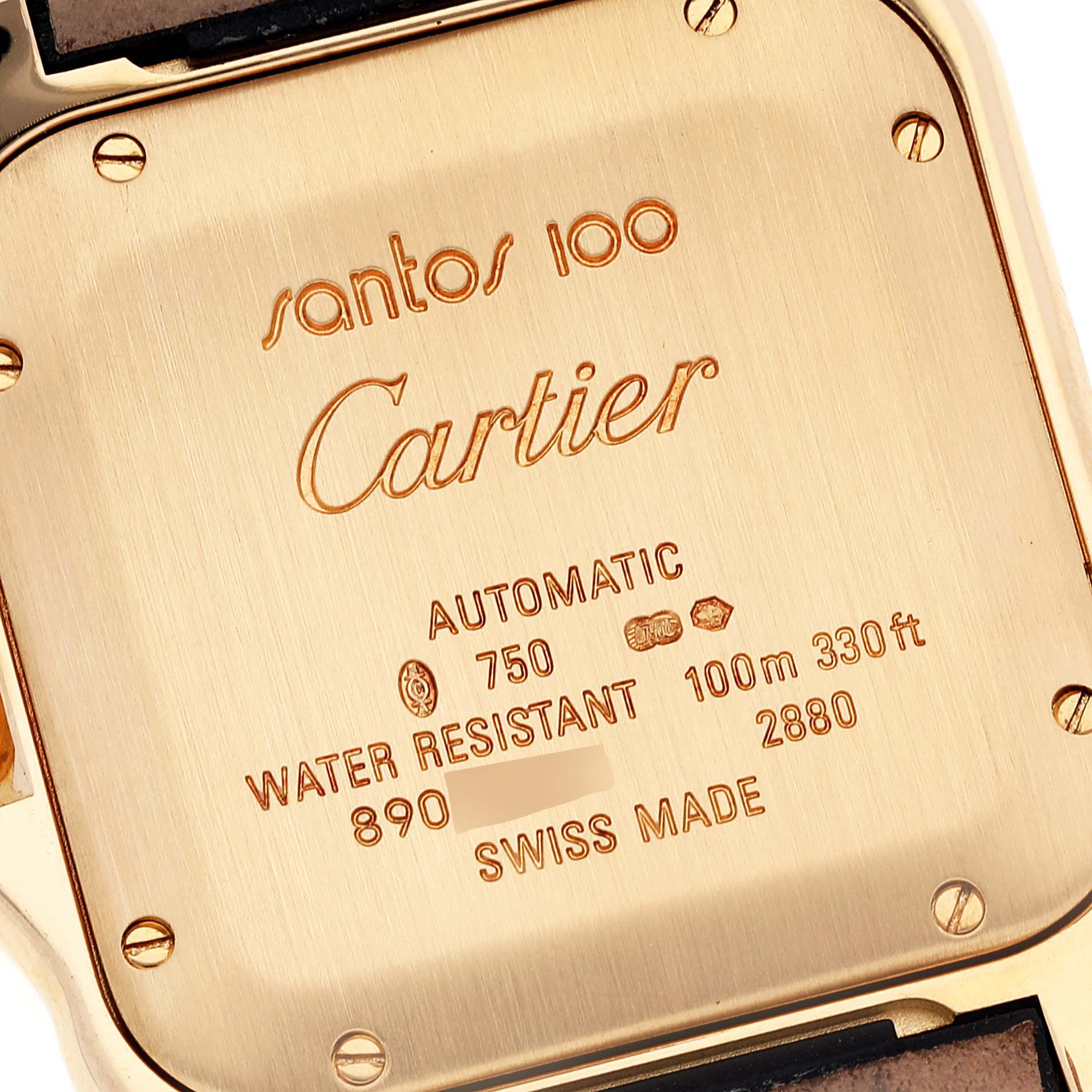 The image shows the case back of a Cartier Santos WM502051 Men's Yellow Gold Silver Dial WM502051 Men's Yellow Gold Silver Dial 100 watch with engraved specifications and markings.