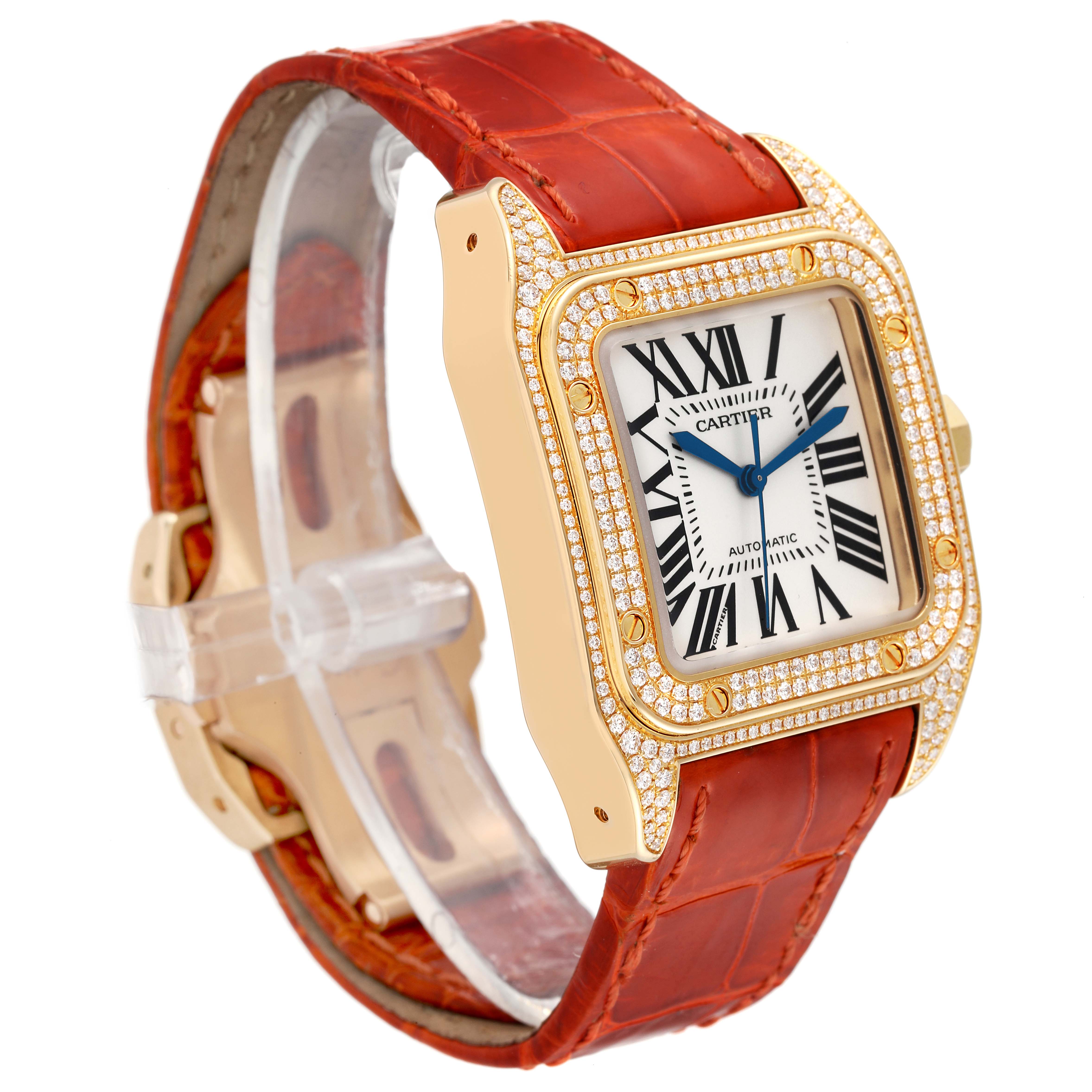 The Cartier Santos WM502051 Men's Yellow Gold Silver Dial WM502051 Men's Yellow Gold Silver Dial watch is shown at a three-quarter angle, highlighting its gold case with diamonds and red leather strap.