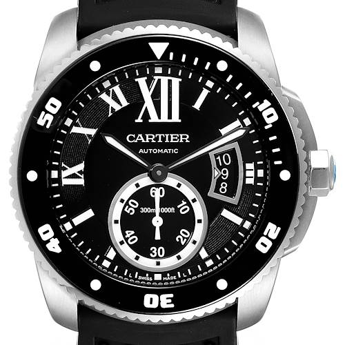 The image shows a frontal view of the dial of the Calibre de Cartier watch by Cartier, highlighting its hands, numbers, and case.