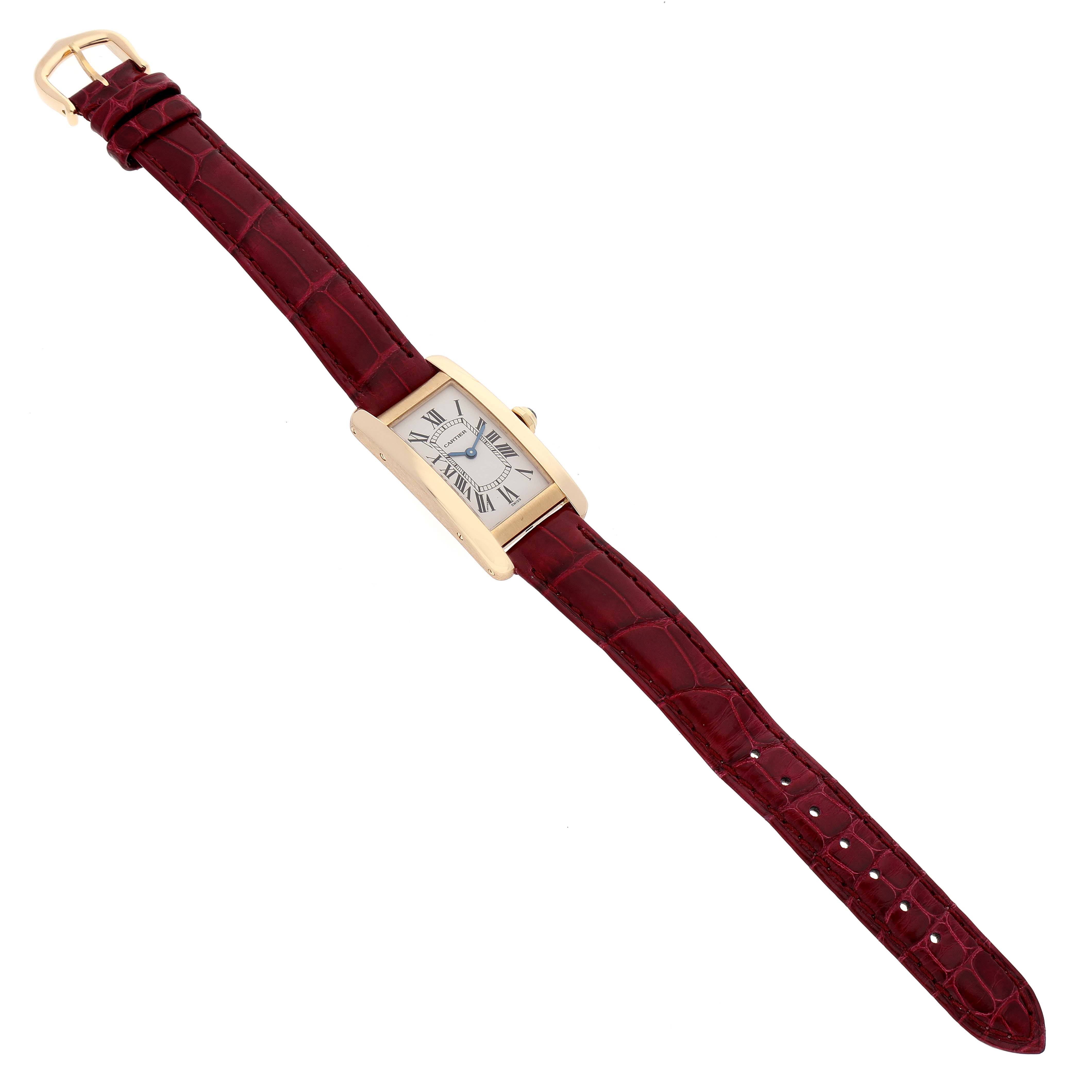 The Cartier Tank Americaine W2601556 Women's Yellow Gold Silver Dial W2601556 Women's Yellow Gold Silver Dial watch is shown from a top-down angle, displaying its rectangular case, white dial, and maroon leather strap.