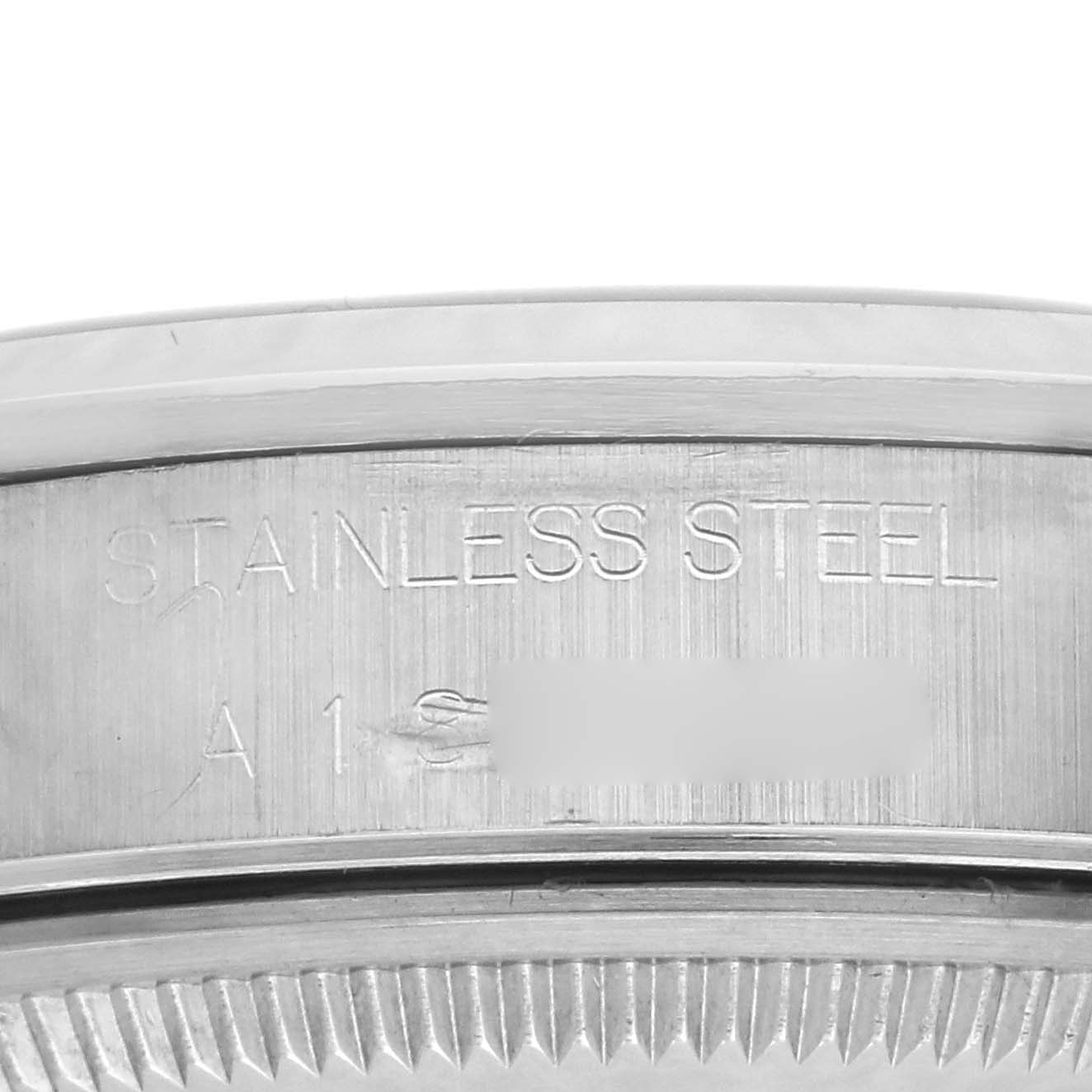 The image shows a close-up of the side detail on a Rolex Date 15200 Men's Stainless Steel Pink Dial 15200 Men's Stainless Steel Pink Dial model, highlighting the stainless steel engraving.