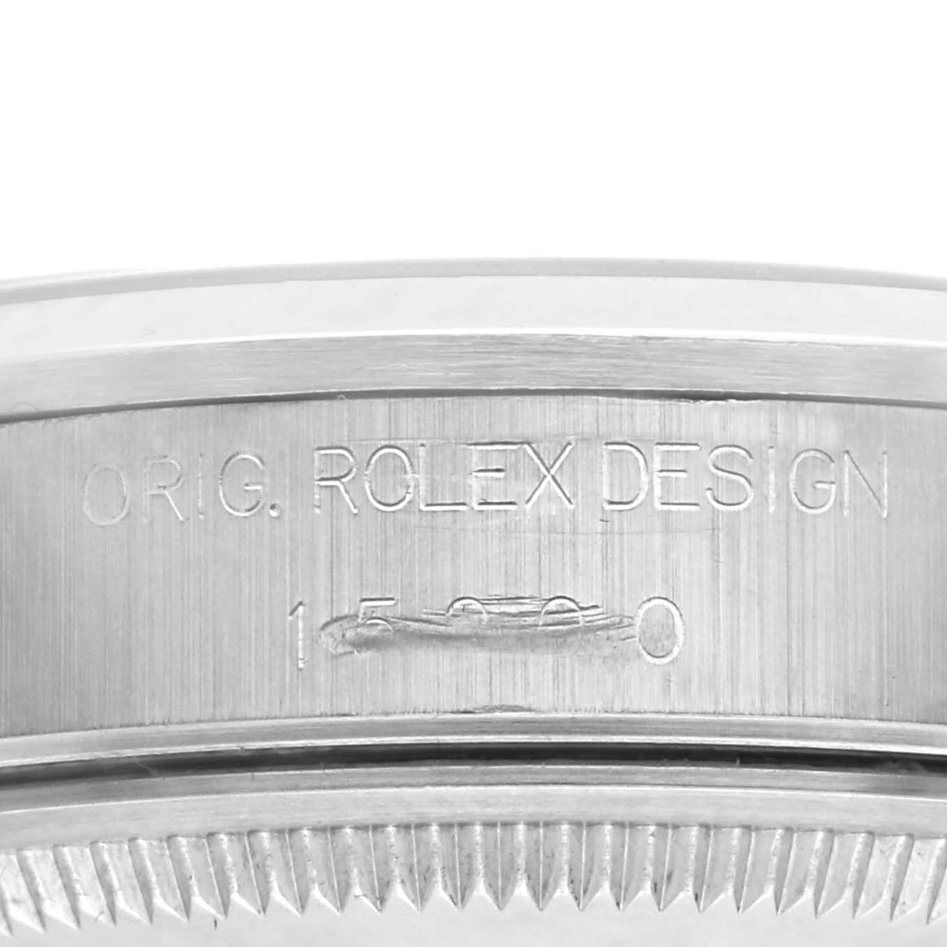 The image shows a close-up of the side of a Rolex Date 15200 Men's Stainless Steel Pink Dial 15200 Men's Stainless Steel Pink Dial model watch, highlighting the engraved design number.