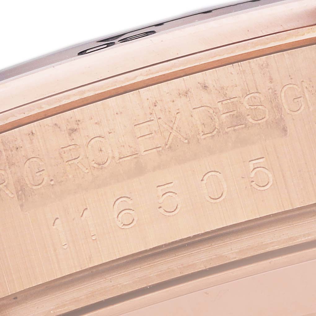 The image shows a close-up of the Rolex Daytona 116505 Men's Rose Gold Black Dial 116505 Men's Rose Gold Black Dial model's inner case with engraved text and model number.