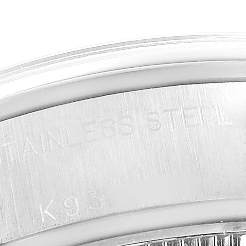 The image shows a close-up of the stainless steel case back of a Rolex Date 79160 Women's Stainless Steel White Dial 79160 Women's Stainless Steel White Dial model watch.