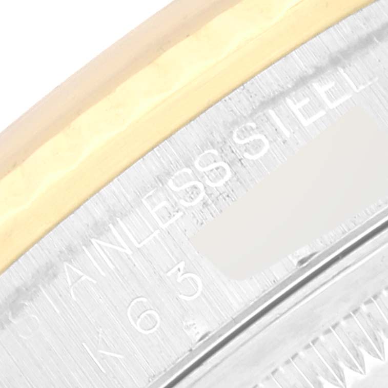 This close-up image shows the side of the Rolex Datejust 16233 Men's Steel and Gold (two tone) Mother of Pearl Dial 16233 Men's Steel and Gold (two tone) Mother of Pearl Dial watch, highlighting the stainless steel and gold bezel.