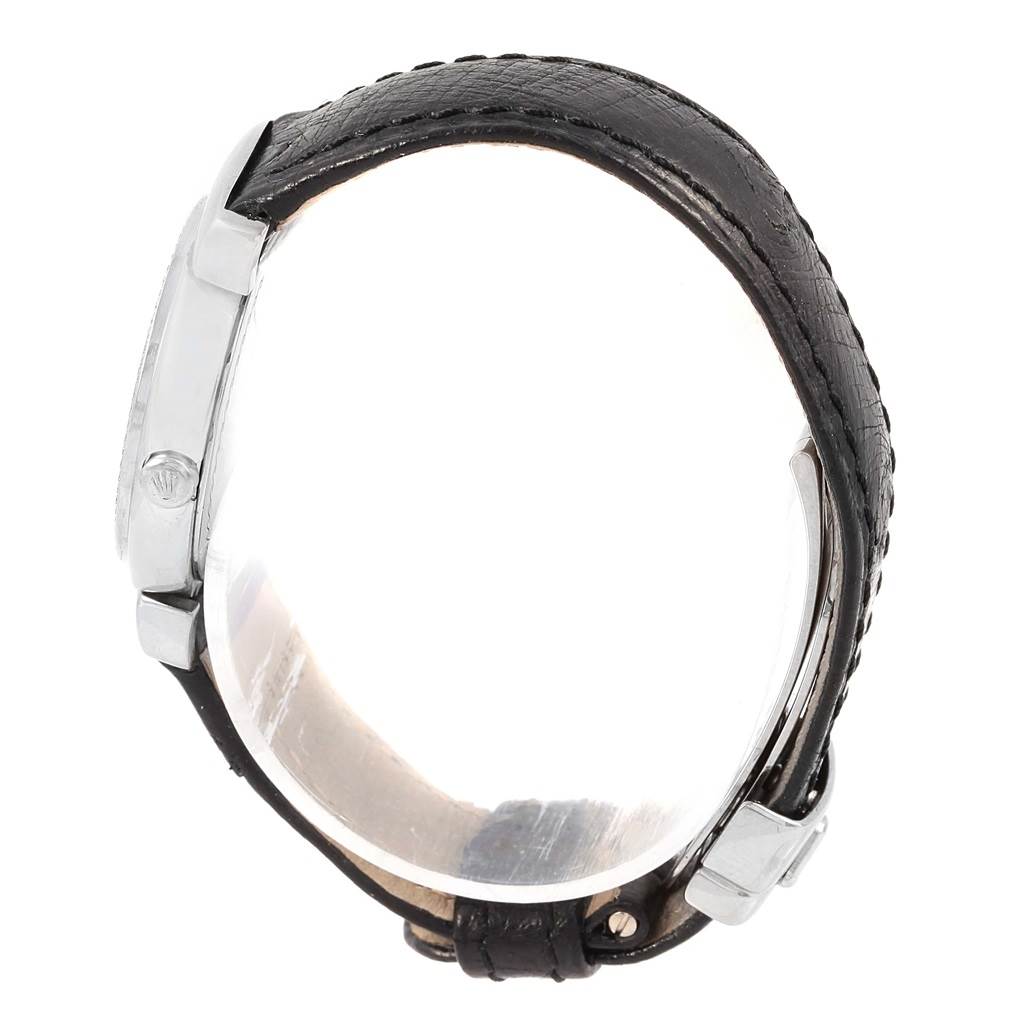 The Rolex Cellini 6671 Women's White Gold Silver Dial 6671 Women's White Gold Silver Dial watch is shown from a side angle, displaying its case, crown, lugs, and black leather strap.