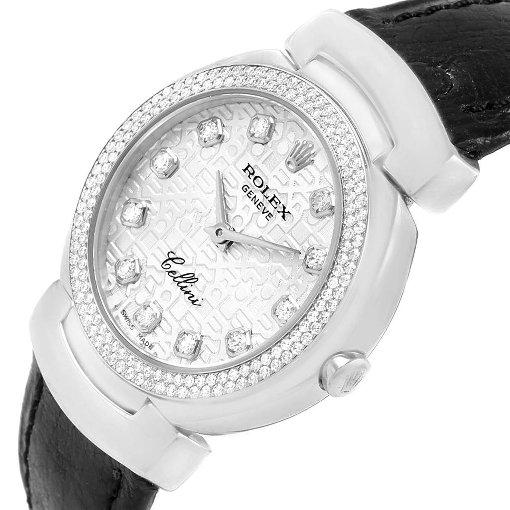 The image shows a close-up of the Rolex Cellini 6671 Women's White Gold Silver Dial 6671 Women's White Gold Silver Dial watch's face and partial leather strap, viewed from an angle revealing the bezel and side.