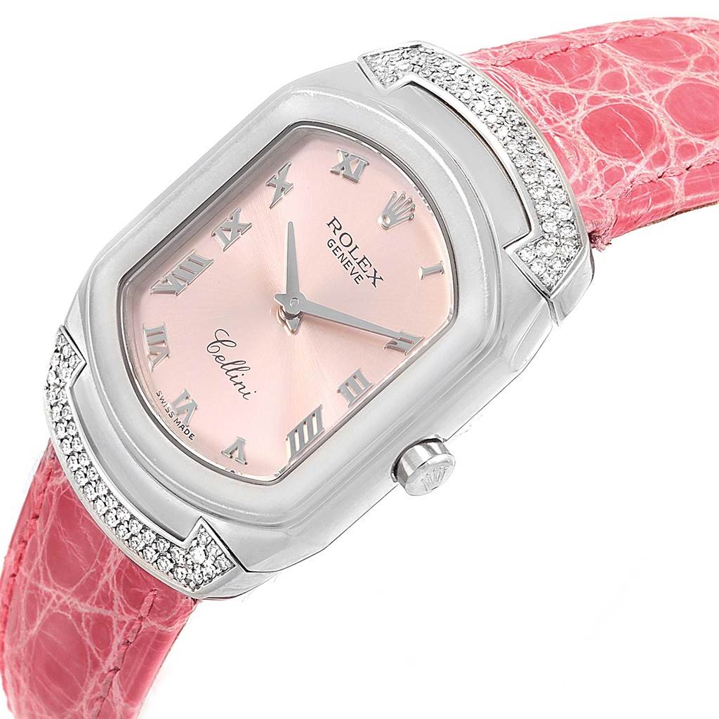 The image shows a close-up of a Rolex Cellini 6692 Women's White Gold Pink Dial 6692 Women's White Gold Pink Dial watch with a pink dial and pink strap.