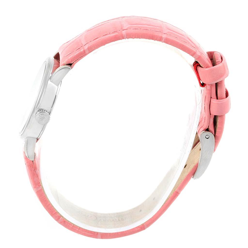 The Rolex Cellini 6110 Women's White Gold Silver Dial 6110 Women's White Gold Silver Dial watch is shown from the side, highlighting the pink strap and crown.