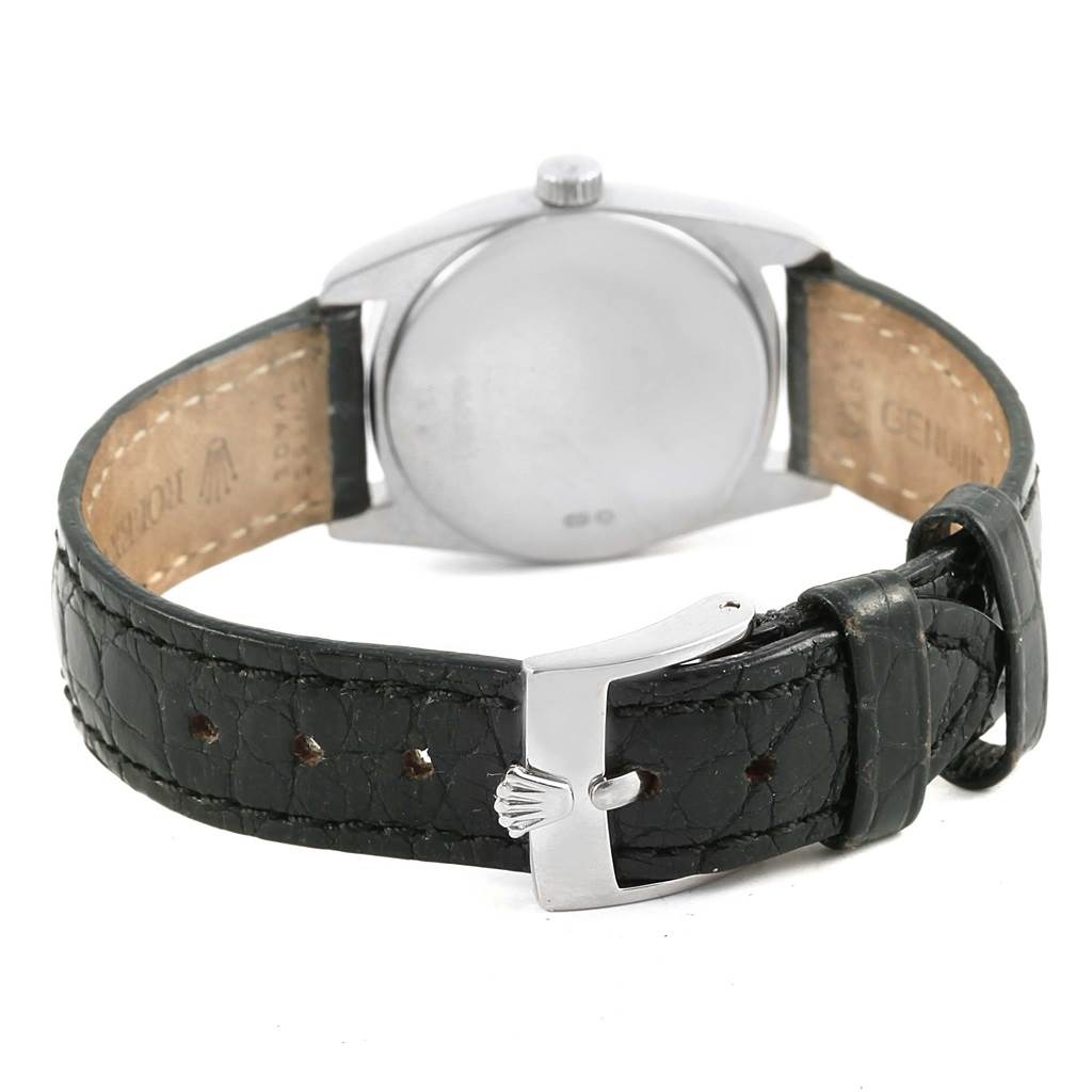 The image shows the back view of a Rolex Cellini 6229 Women's White Gold Black Dial 6229 Women's White Gold Black Dial watch, featuring its leather strap and buckle.