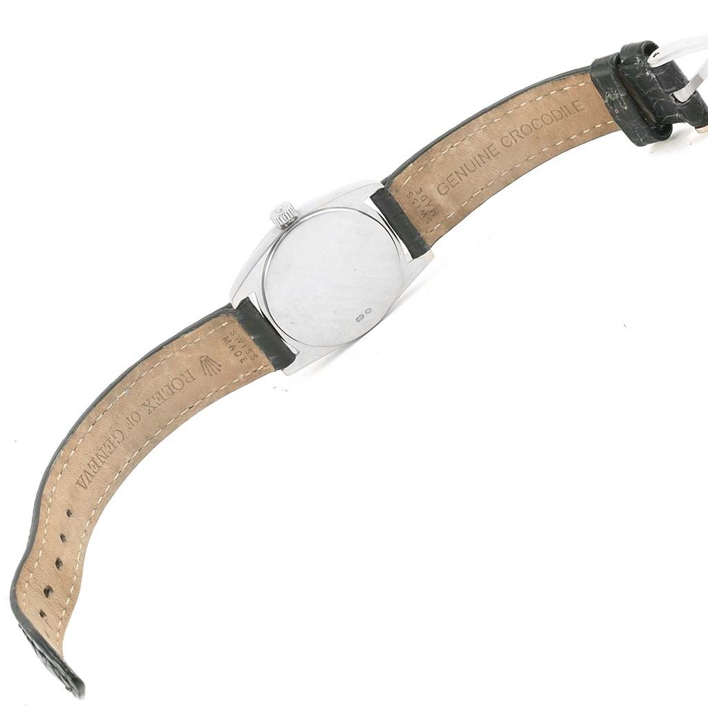 The image shows the back case and inner leather strap of a Rolex Cellini 6229 Women's White Gold Black Dial 6229 Women's White Gold Black Dial watch at a diagonal angle.