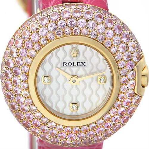 This image shows a close-up view of the Rolex Cellini 6201 Women's Yellow Gold Mother of Pearl Dial 6201 Women's Yellow Gold Mother of Pearl Dial watch face, adorned with pink gemstones.
