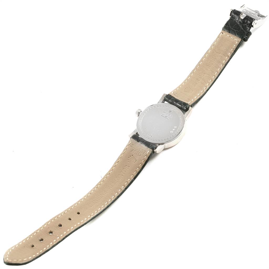 The image shows the back view of a Rolex Cellini 6110 Women's White Gold Silver Dial 6110 Women's White Gold Silver Dial watch, highlighting its caseback, strap, and buckle.