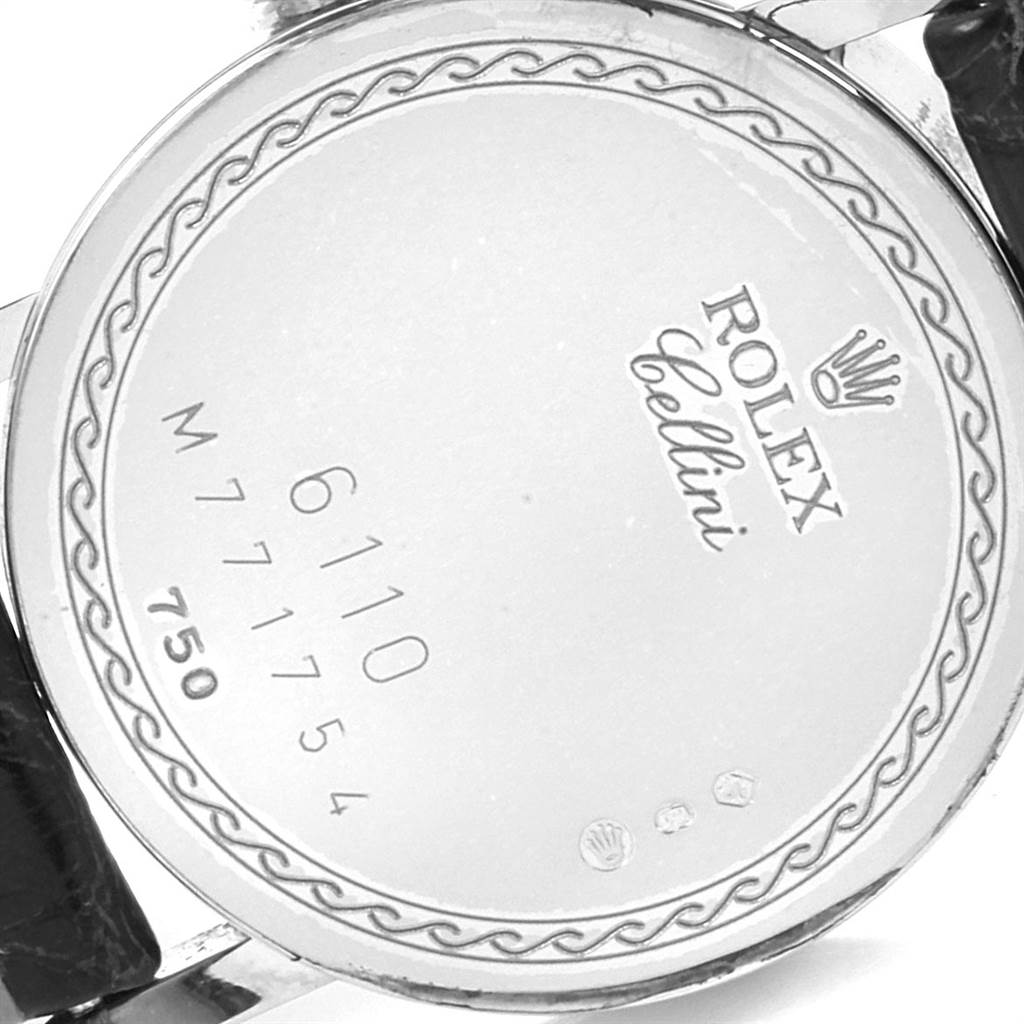 This image shows the back casing of a Rolex Cellini 6110 Women's White Gold Silver Dial 6110 Women's White Gold Silver Dial watch, displaying model and serial numbers.