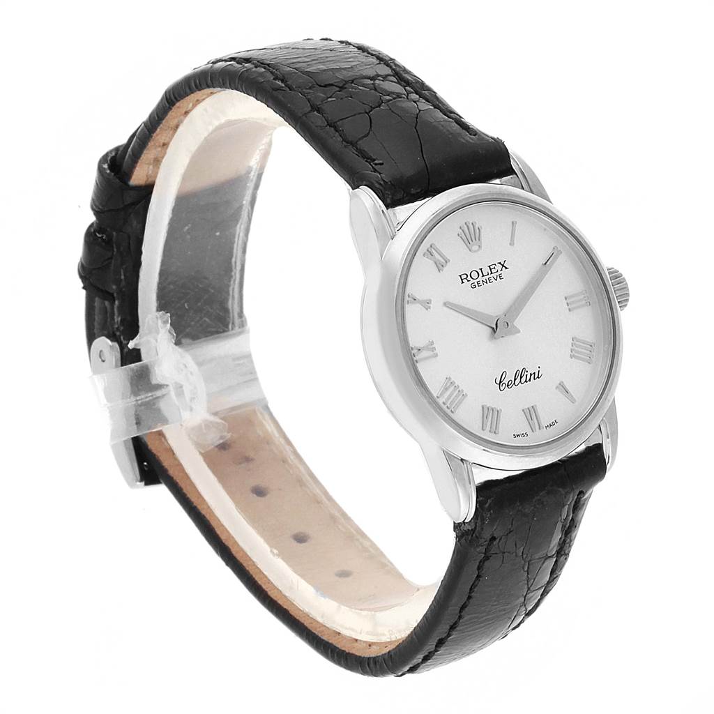 The Rolex Cellini 6111 Women's White Gold Silver Dial 6111 Women's White Gold Silver Dial watch is shown angled from the front-left, highlighting the dial, roman numerals, and black leather strap.