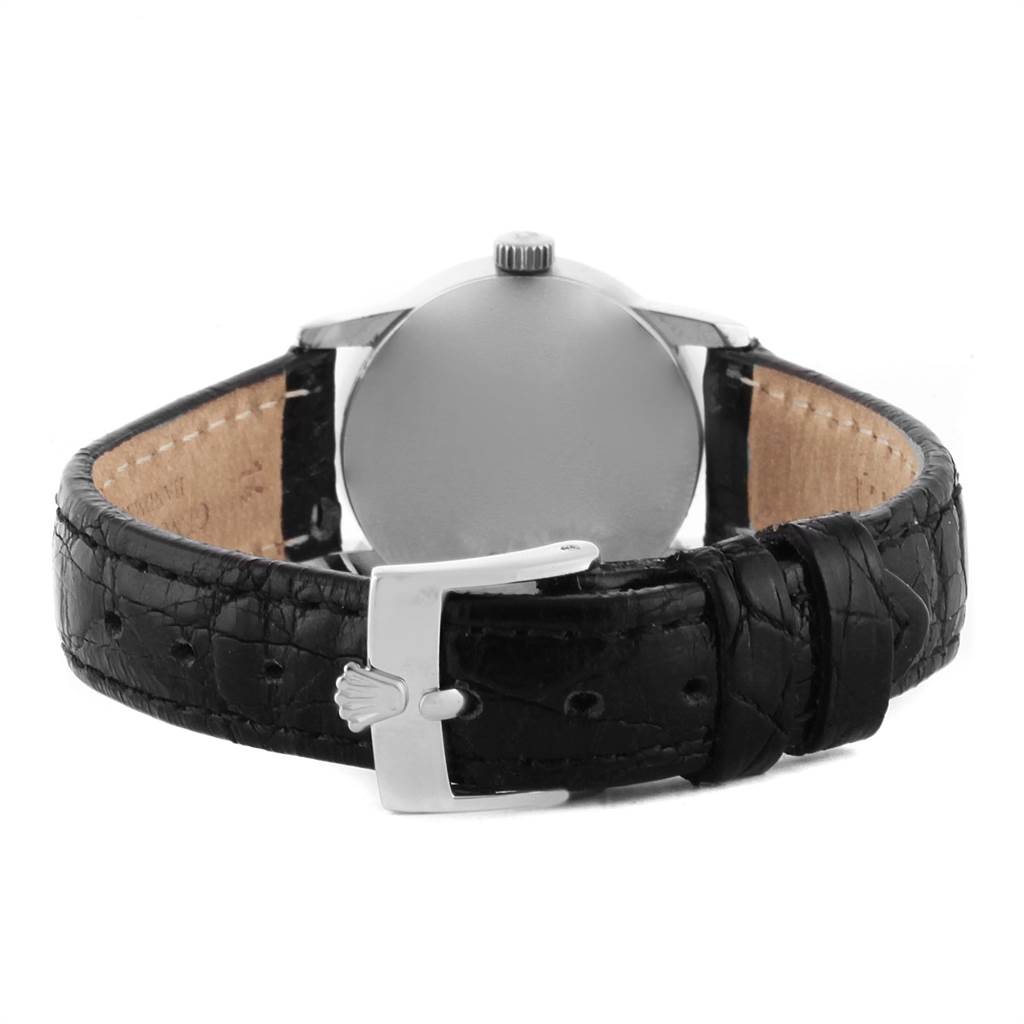 The image shows the back view of the Rolex Cellini 6111 Women's White Gold Silver Dial 6111 Women's White Gold Silver Dial watch, highlighting its buckle and black leather strap.