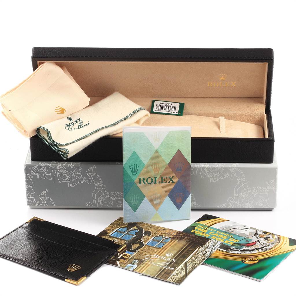 This image shows the packaging and accessories of a Rolex Cellini 6111 Women's White Gold Silver Dial 6111 Women's White Gold Silver Dial watch, including a box, cloths, and manuals from a front angle.