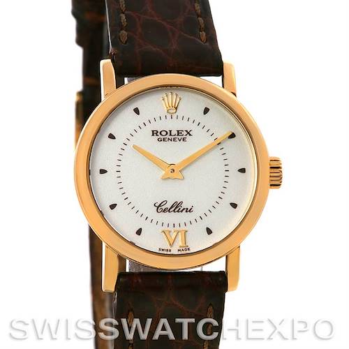 The image shows a frontal view of a Rolex Cellini 6110 Women's Yellow Gold Silver Dial 6110 Women's Yellow Gold Silver Dial watch, featuring a gold case, white dial, and brown leather strap.