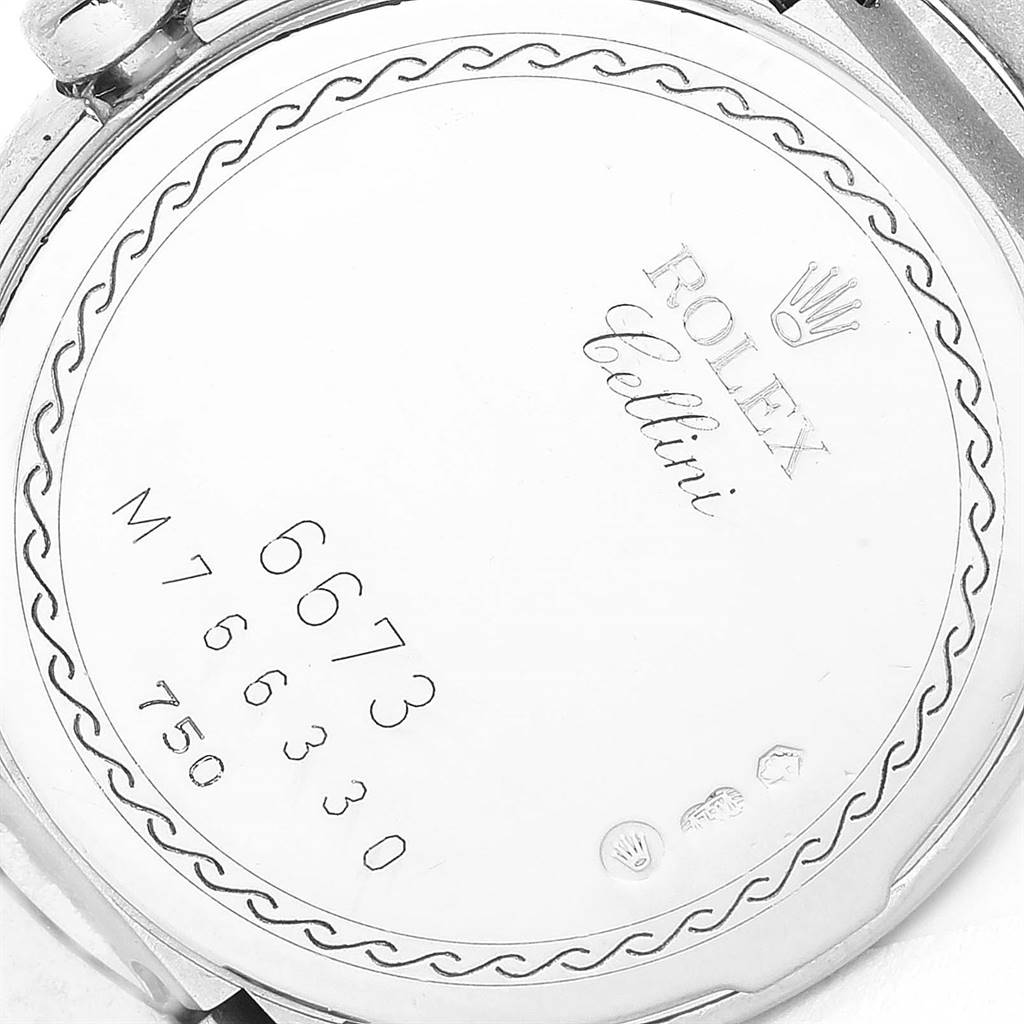 The image shows the back case of a Rolex Cellini 6673 Women's White Gold Silver Dial 6673 Women's White Gold Silver Dial watch, featuring the model and serial numbers.