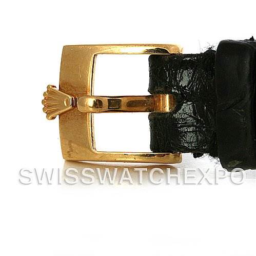 This image shows a close-up of the gold clasp and black leather strap of a Rolex Cellini 4109 Women's Yellow Gold White Dial 4109 Women's Yellow Gold White Dial watch.