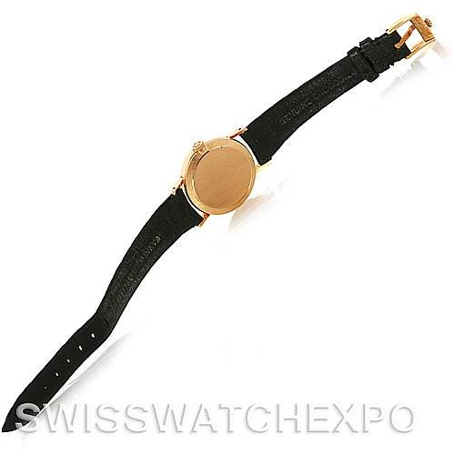 The image shows the back of a Rolex Cellini 4109 Women's Yellow Gold White Dial 4109 Women's Yellow Gold White Dial watch, highlighting its black leather strap and gold-tone case, at an overhead angle.