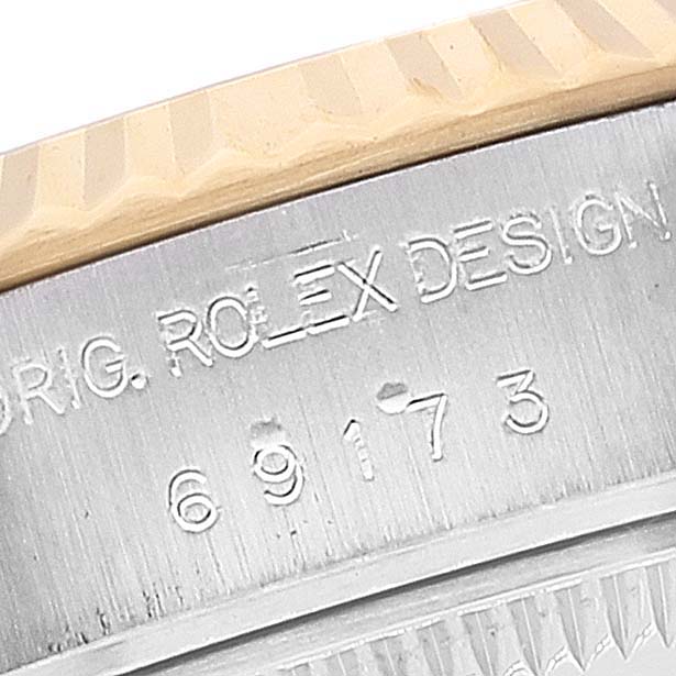 This image shows the model number and engraved "ROLEX DESIGN" text on the side of the band from a Rolex Datejust 69173 Women's Steel and Gold (two tone) Grey Dial 69173 Women's Steel and Gold (two tone) Grey Dial.