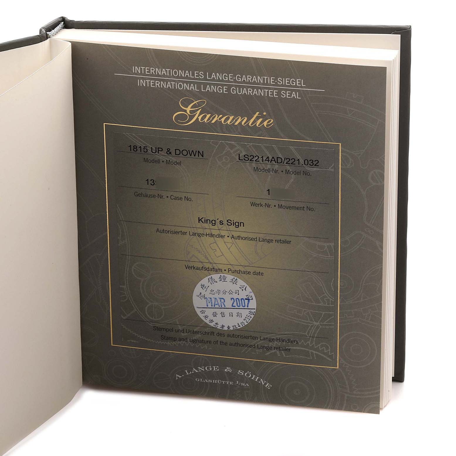 The image shows the warranty certificate booklet for the 1815 model by A. Lange & Söhne, opened flat.