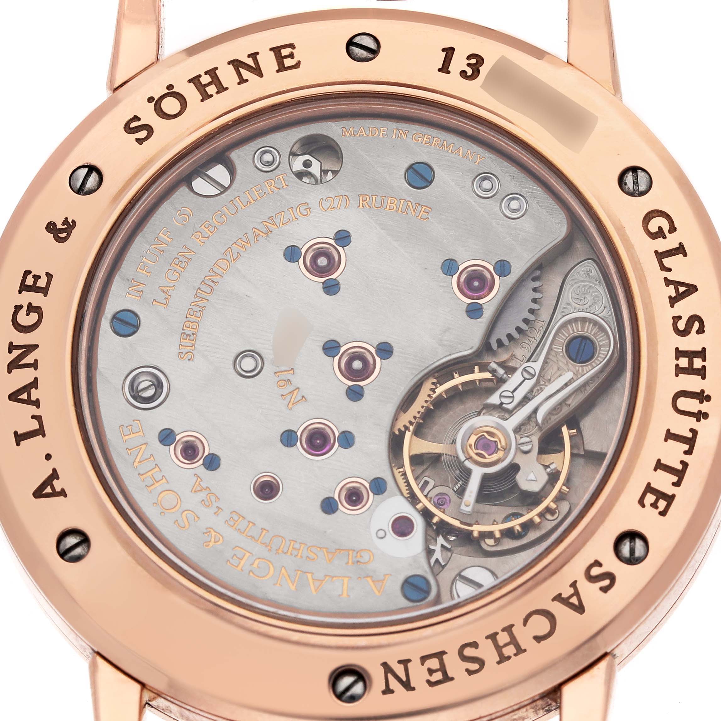 The image shows the back view of the A. Lange & Sohne 1815 221.032 / LSLS2214AD Men's Rose Gold Silver Dial model, showcasing its intricate internal mechanisms.