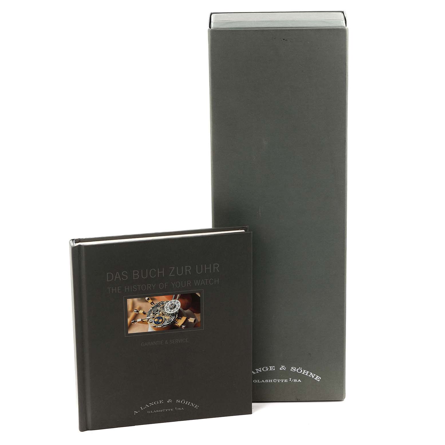 The image shows the packaging and booklet for the 1815 model by A. Lange & Söhne, viewed from the front.