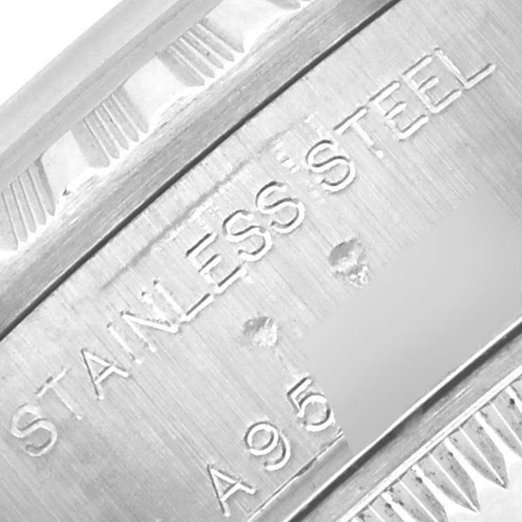 The image shows a close-up of the outer case side or rim with "STAINLESS STEEL" engraved on the Rolex Date 79240 Women's Stainless Steel White Dial 79240 Women's Stainless Steel White Dial model.