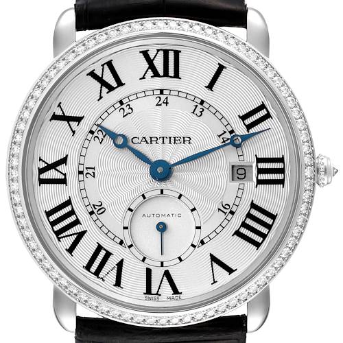 The image shows a close-up of the Cartier Ronde WR007018 Men's White Gold Silver Dial WR007018 Men's White Gold Silver Dial watch, highlighting its face, Roman numerals, and leather strap.