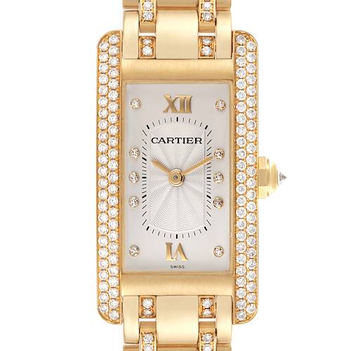 The Cartier Tank Américaine watch is shown from a top-down angle, highlighting its rectangular face and diamond accents.