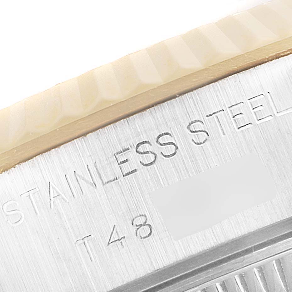 This image shows a close-up of the side engraving on the stainless steel case of a Rolex Datejust 69173 Women's Steel and Gold (two tone) Champagne Dial 69173 Women's Steel and Gold (two tone) Champagne Dial model watch.