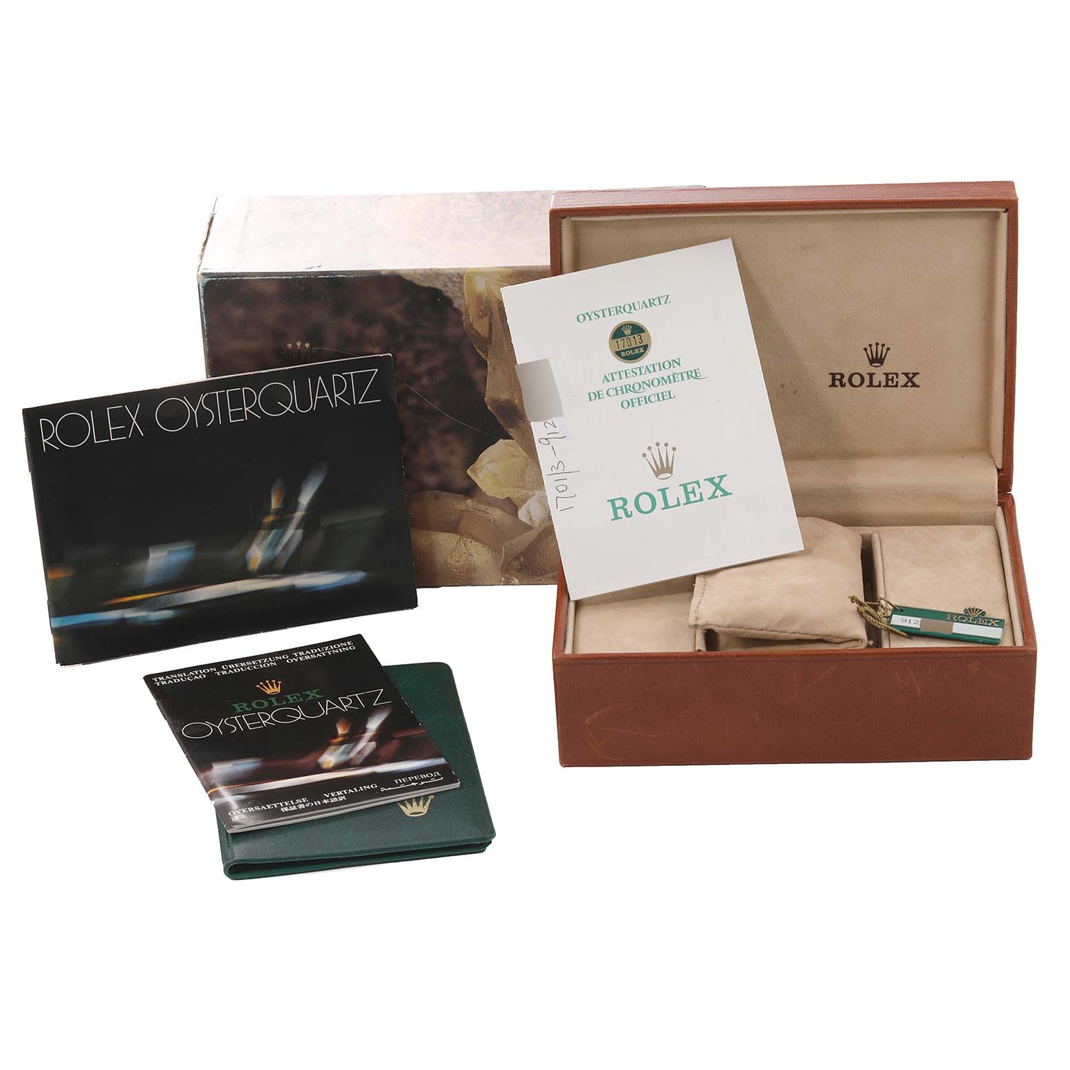 The image shows the packaging and booklets for the Rolex Oysterquartz 17013 Men's Steel and Gold (two tone) White Dial 17013 Men's Steel and Gold (two tone) White Dial watch, along with its original box and warranty card.