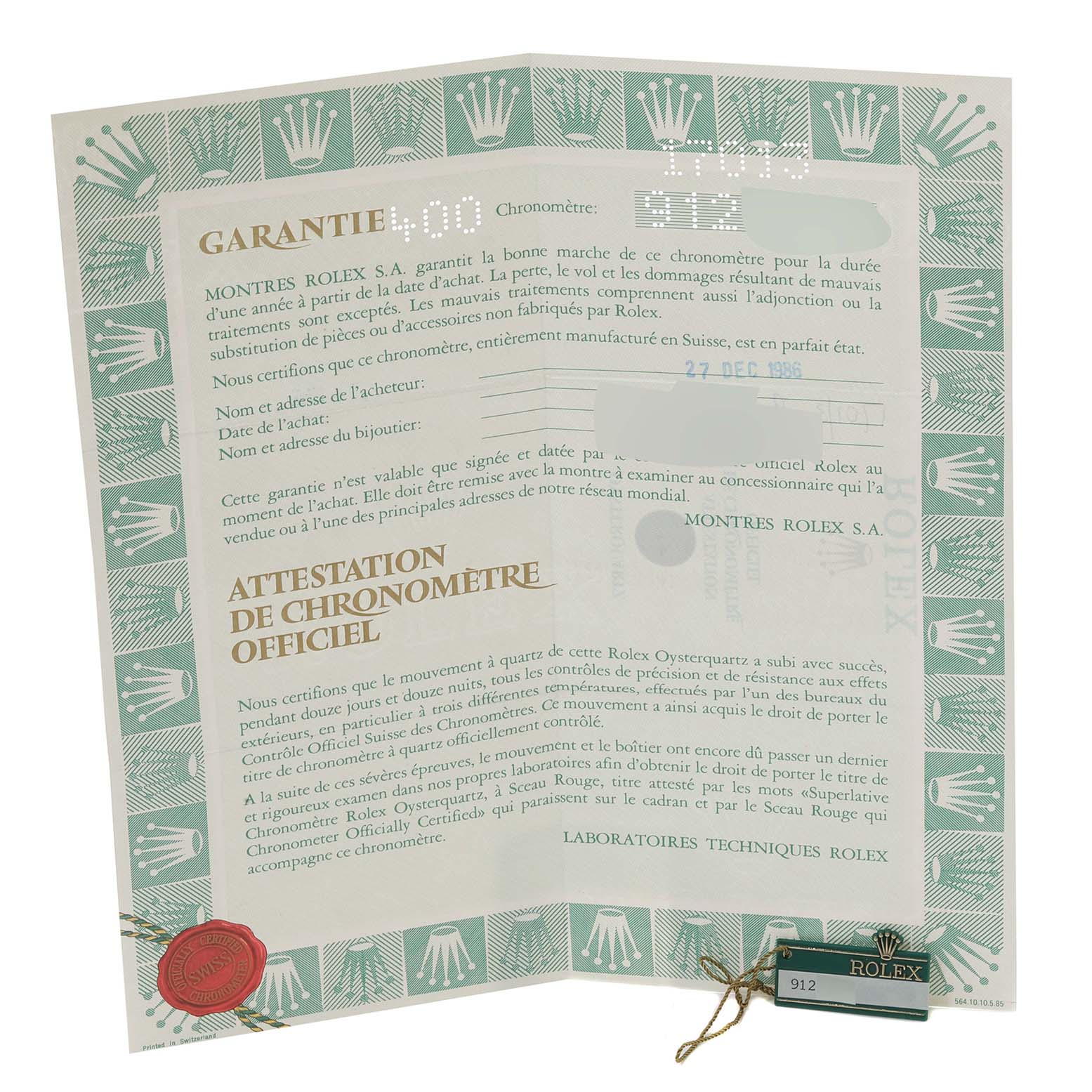 The image shows an official chronometer certificate and warranty for a Rolex Oysterquartz 17013 Men's Steel and Gold (two tone) White Dial 17013 Men's Steel and Gold (two tone) White Dial watch from a top-down angle.