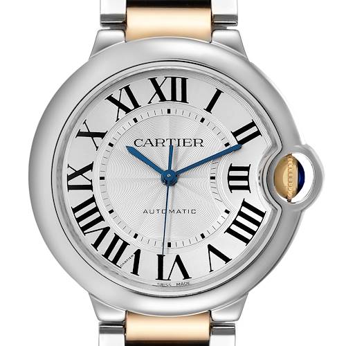 The image shows a front view of the Cartier Ballon Bleu W2BB0012 Women's Steel and Gold (two tone) Silver Dial W2BB0012 Women's Steel and Gold (two tone) Silver Dial watch, highlighting the dial, Roman numerals, and crown with a blue cabochon.