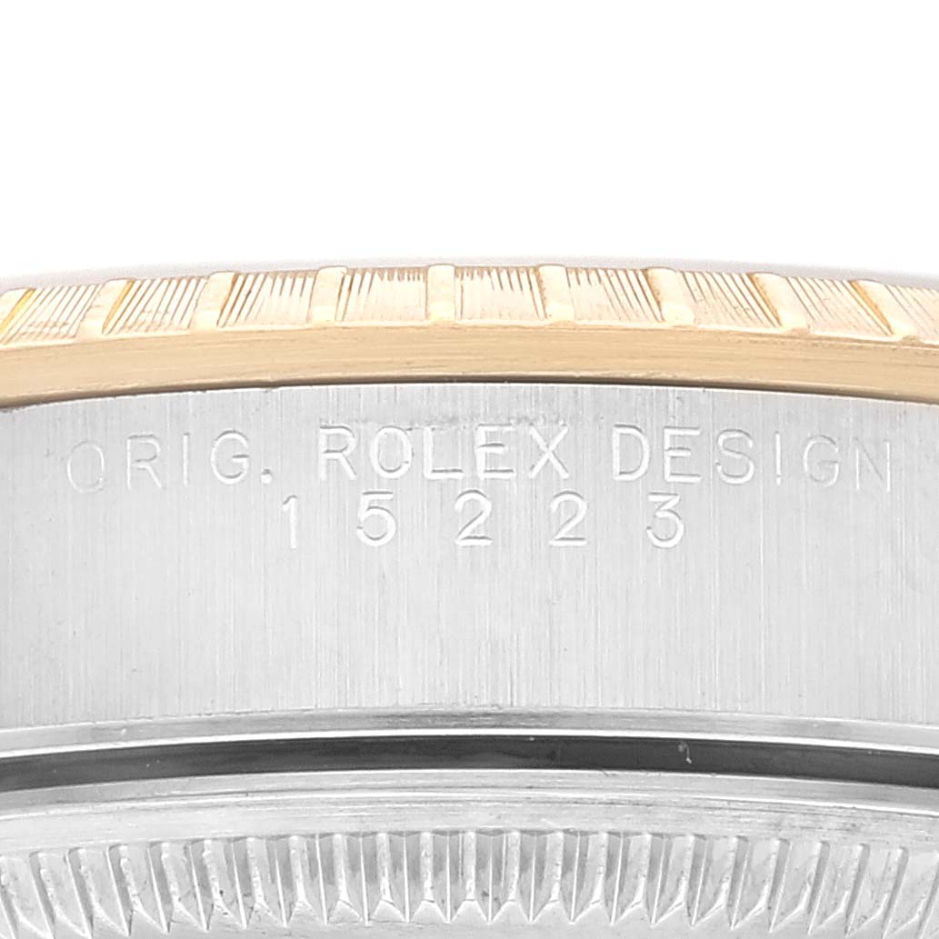 This image shows a close-up of the case and bezel with the engraved model number 15223 for the Rolex Date 15223 Men's Steel and Gold (two tone) Champagne Dial 15223 Men's Steel and Gold (two tone) Champagne Dial.