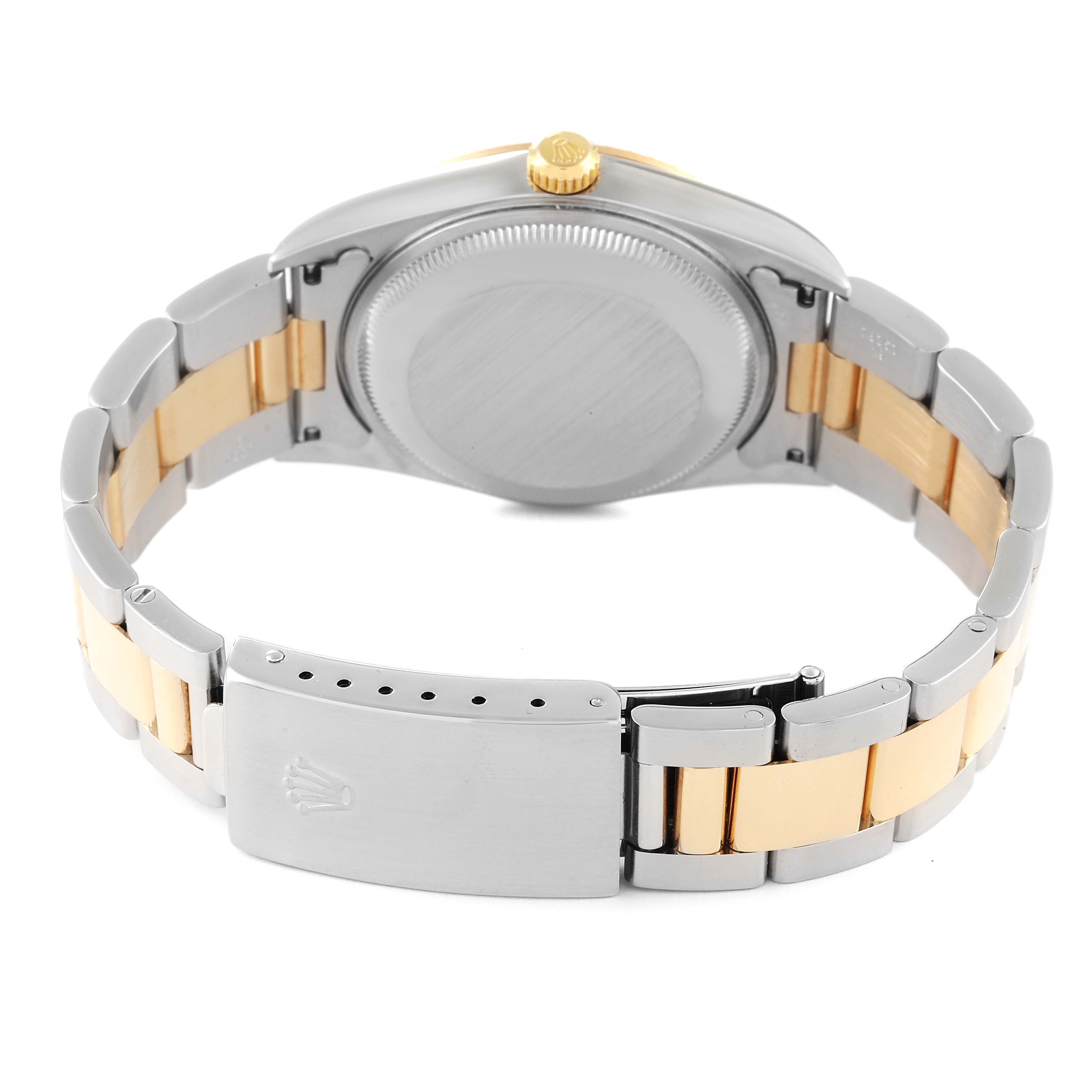 This image shows the back case and two-tone bracelet of a Rolex Date 15223 Men's Steel and Gold (two tone) Champagne Dial 15223 Men's Steel and Gold (two tone) Champagne Dial model watch, with focus on the clasp and crown.