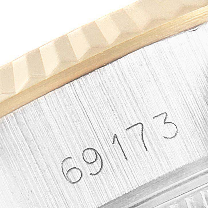 This close-up shows the side of a Rolex Datejust 69173 Women's Steel and Gold (two tone) Champagne Dial 69173 Women's Steel and Gold (two tone) Champagne Dial watch, highlighting the model number 69173 beneath the bezel.