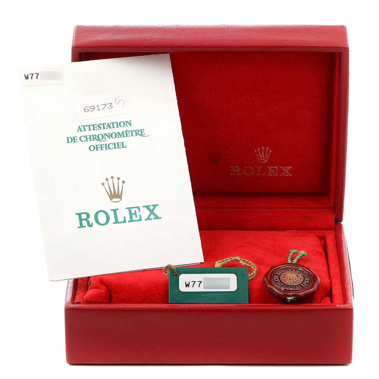 Shown are a Rolex Datejust 69173 Women's Steel and Gold (two tone) Champagne Dial 69173 Women's Steel and Gold (two tone) Champagne Dial model box, a tag, and an official chronometer certification.