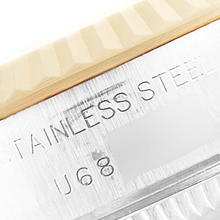 The image shows a close-up of the side of a Rolex Datejust 69173 Women's Steel and Gold (two tone) Champagne Dial 69173 Women's Steel and Gold (two tone) Champagne Dial, highlighting the "STAINLESS STEEL" engraving.